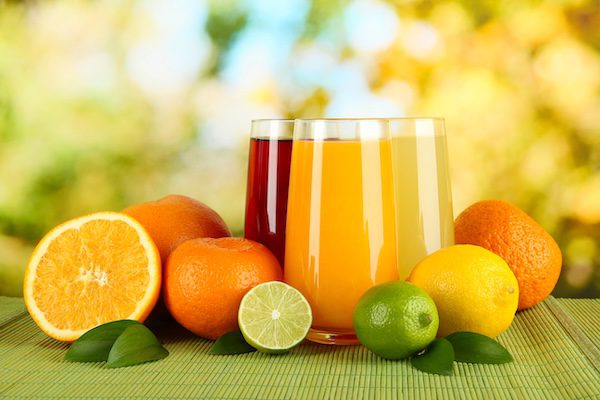 glasses of fruit juice and fruit